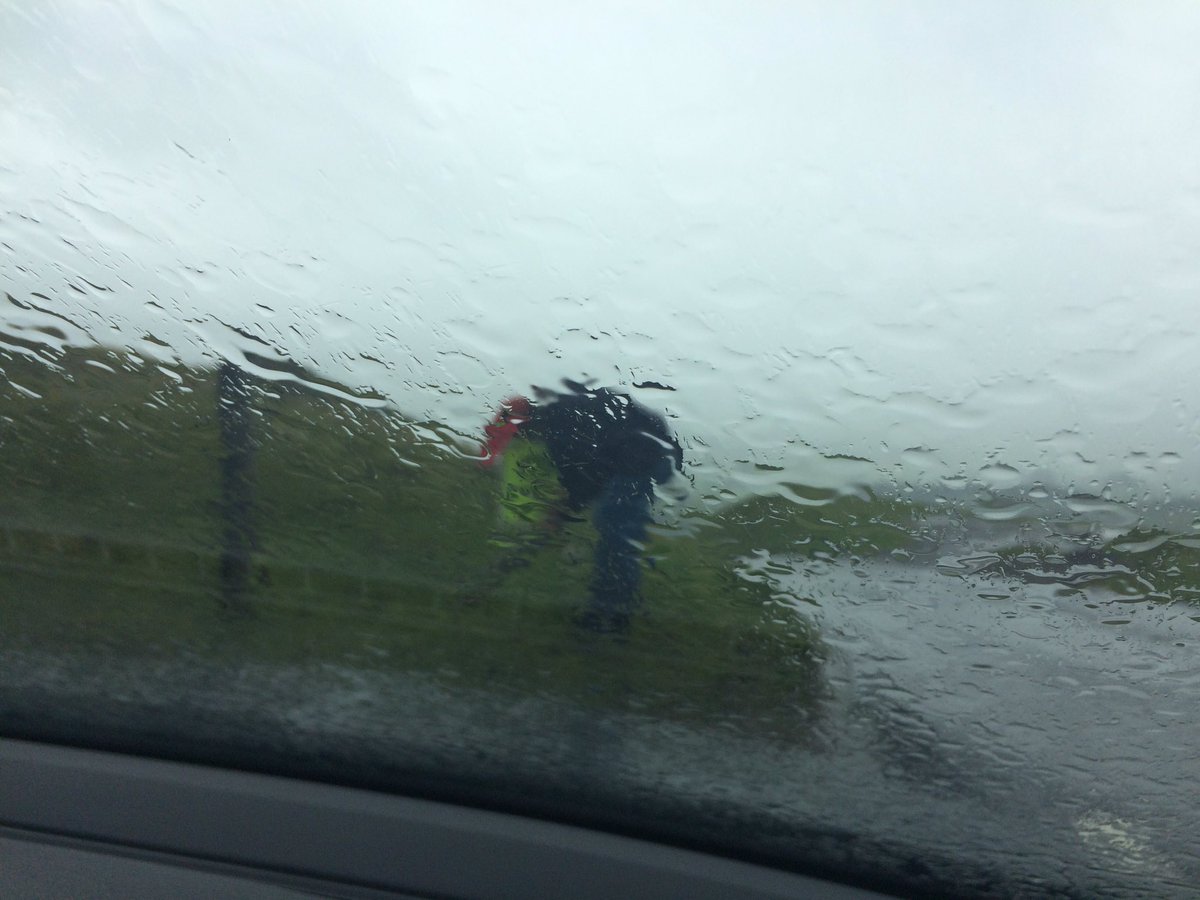 helping <a href="/mytriclub/">MyTriEvents</a> today to set up Wensleydale Tri. Weather not great!, Pic is someone trying to fix a sign to fence