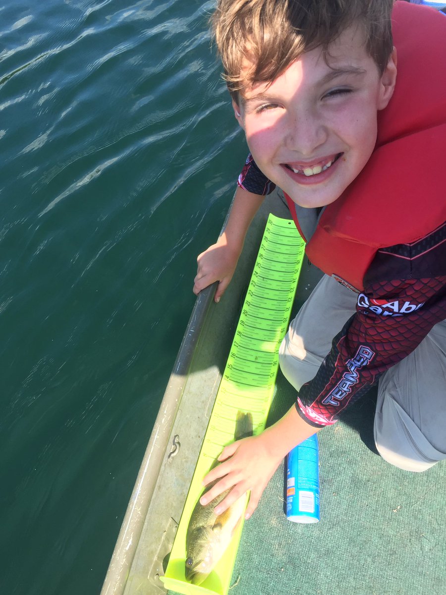 JasonBarnucz's tweet photo. Trevor's biggest, a 12" Largemouth Bass. No giant but a big smile! #fishathon #DeerCreekCA @longpointca @FishAThonON https://t.co/c93twegd2k