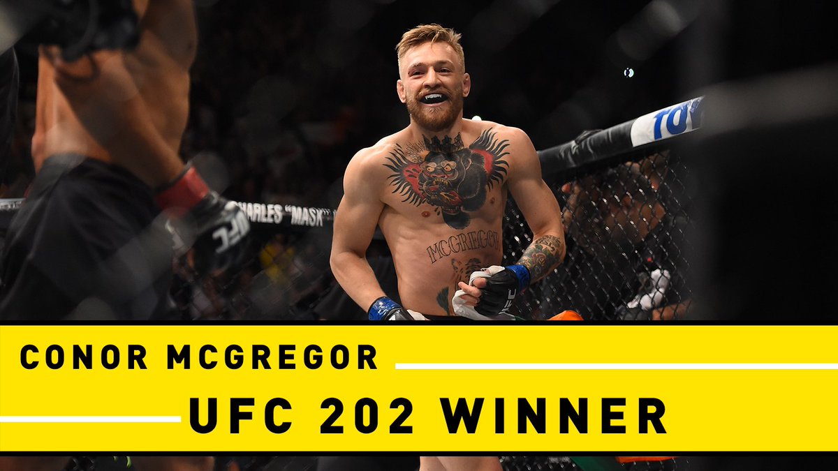 espn's tweet photo. Revenge. Is. Sweet! 

Conor McGregor defeats Nate Diaz by majority decision at #UFC202. https://t.co/x326ezXRHs