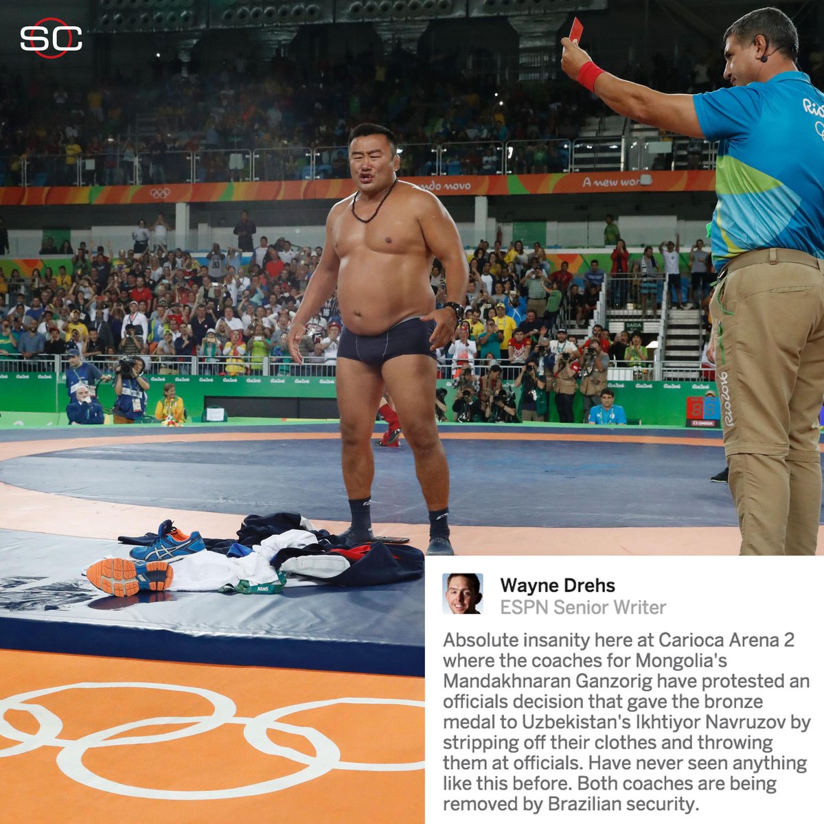 SportsCenter's tweet photo. This is wild: Mongolian wrestling coaches protest bronze medal match loss by throwing their clothes at officials. https://t.co/yczfQt62Yn