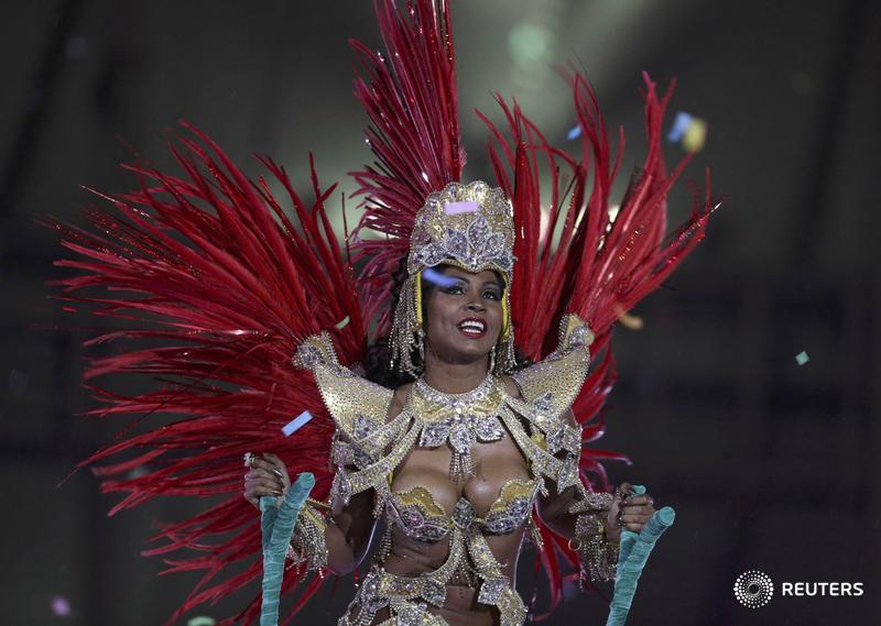 Reuters's tweet photo. More Carnival than clockwork, but Rio pulls it off: https://t.co/1V1f0S0Ib4 https://t.co/wiQHRLlE8w