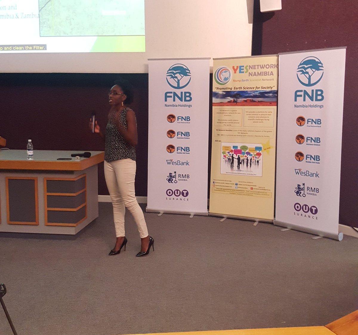 MME_Nam's tweet photo. Ms Josephine Uushona presenting her research paper  at the @FNBNamibia  sponsorship event for the @YESnetworkNam https://t.co/0cNawGpAcx