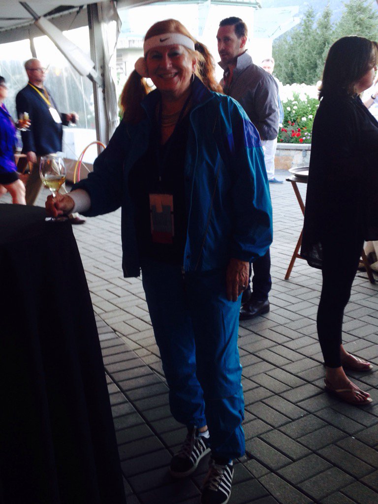 GovProCanada's tweet photo. It's a dark photo but our board director Janis is rocking her 80's wear for #GovConf2016 https://t.co/HiXPkhm29A