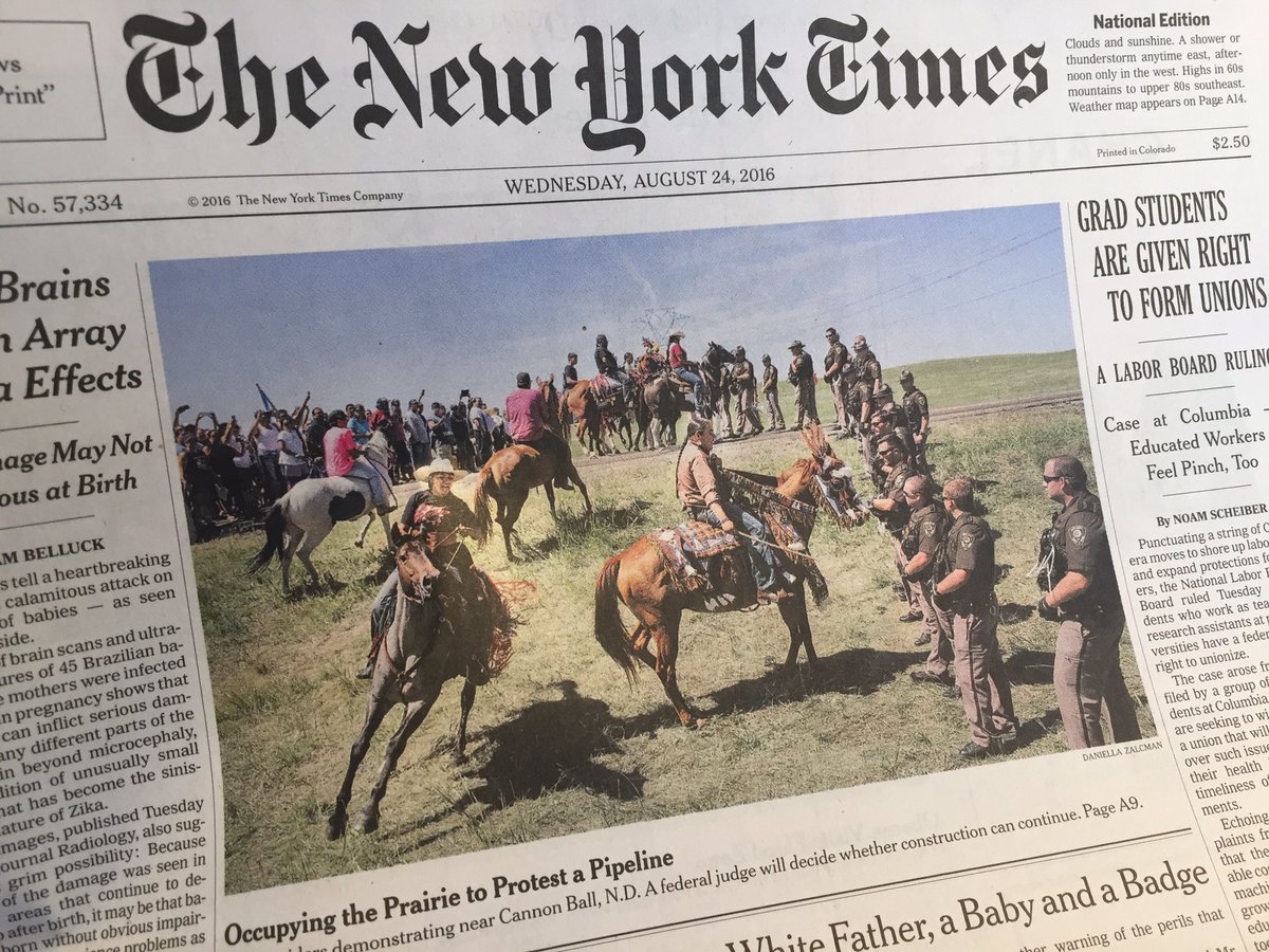 SimonMoyaSmith's tweet image. Front and center. #NoDAPL is on page 1 of the @nytimes today. Photo by @dzalcman. Story by @jackhealyNYT. Hoka.