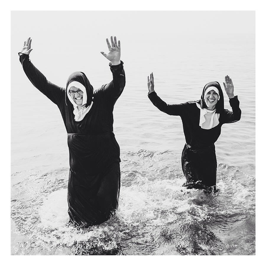 Roman Catholic Nuns enjoying the beach bt in. if wear more comfortable. 