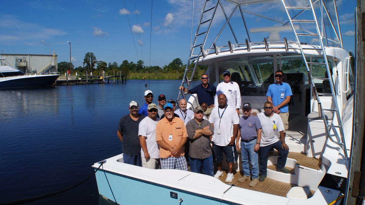 HatterasYachts's tweet photo. The Hatteras factory workers who built this new #45Express got to join in the christening celebration yesterday. https://t.co/nCJJvNaHq6
