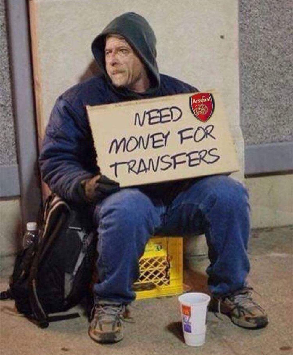 Wenger's reaction after hearing fans chant "spend some fucking money"