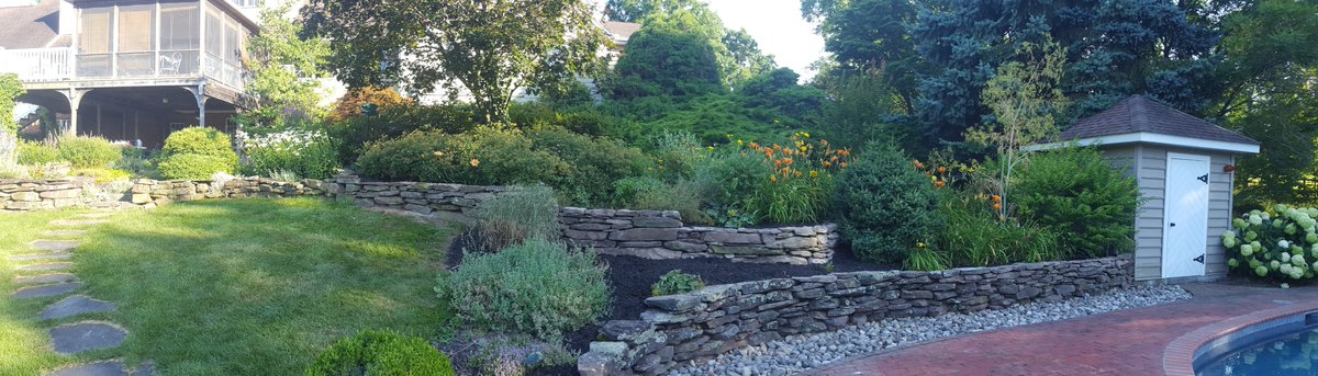 NatureDesignINC's tweet photo. Here are some pictures of a cute garden with our reconstructed garden walls. #stonewall #cottagegarden #landscaping https://t.co/8t7txAusv7