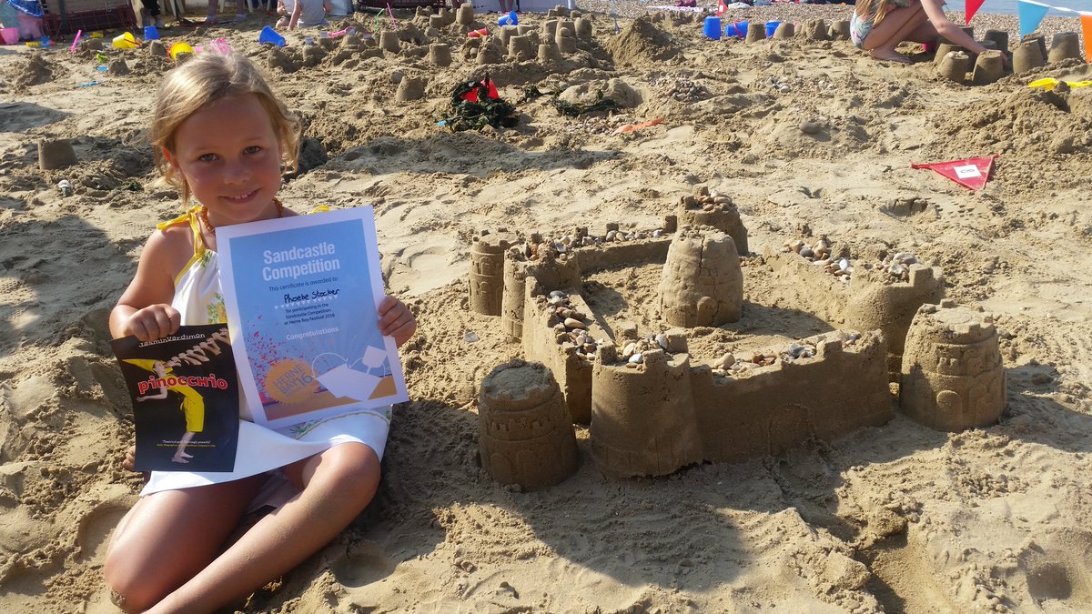 Congrats to today's Sandcastle Champions! Here's Class 2's winner Phoebe with her 1st place castle.