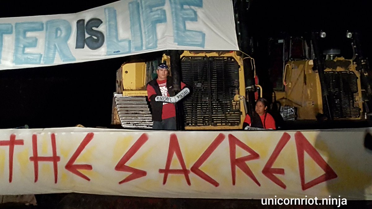 UR_Ninja's tweet image. At least six ppl currently locked down to Dakota Access Pipeline construction #NoDAPL
