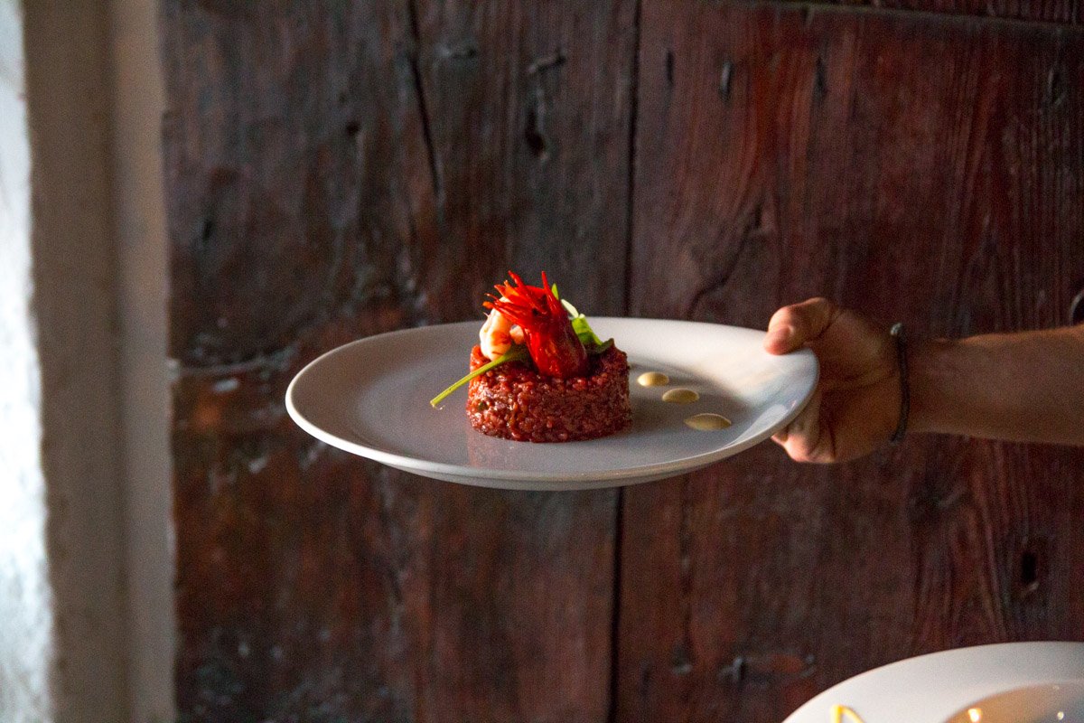 A dish tribute to seafaring food. Red rice with cuttlefish and large red prawns with garlic "pil pil" #Ibiza