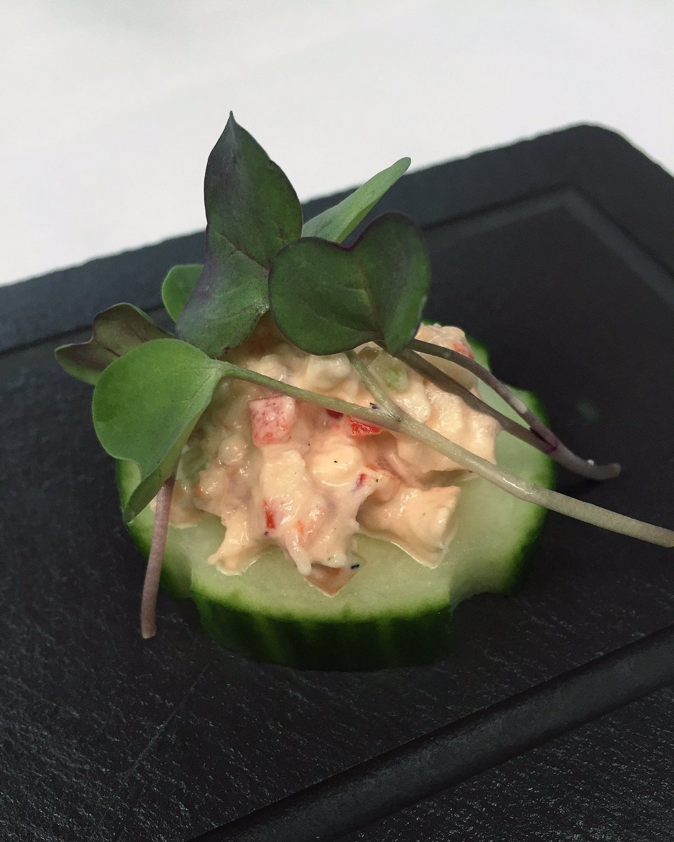 Amusing our bouches with refreshing cucumber topped with crab salad and and arugula sprouts #flordesal #amusebouche