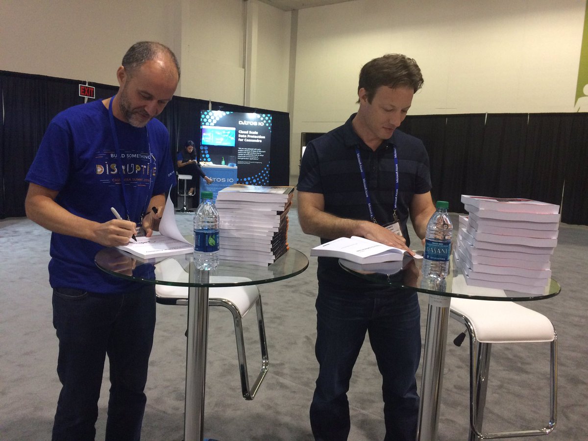 Two of the latest #cassandra book authors <a href="/rs_atl/">Robbie Strickland</a> and Jeff Carpenter signing their books at #cassandrasummit