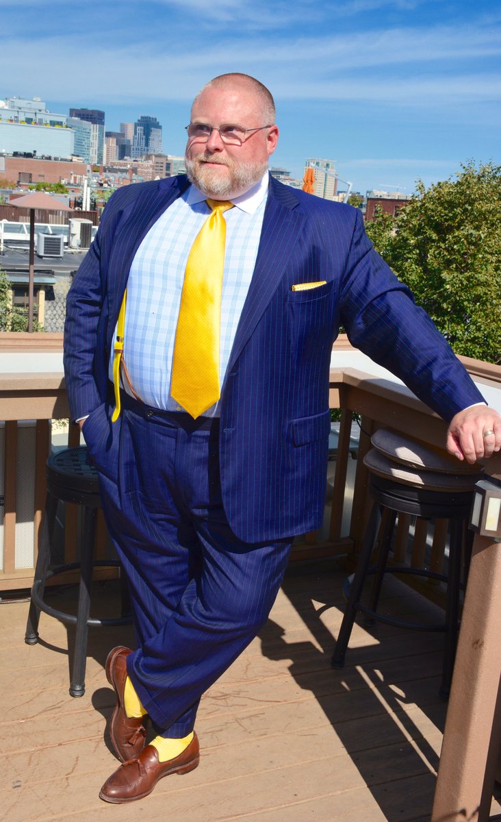 dress shirt untucked with tie