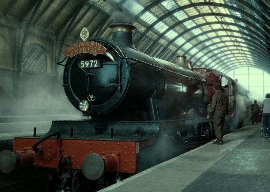 HogwartsIt's tweet photo. Cats of every colour wind between legs, owls hoot disgruntledly over the babble and scraping of trunks. https://t.co/uN9iTUAMCJ