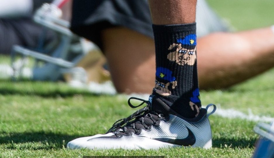 NFL: No Dallas cop tribute stickers allowed, but cop pig socks are cool
