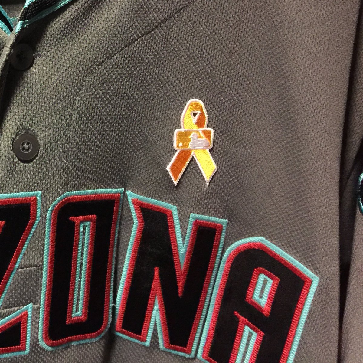 Dbacks's tweet photo. Tonight the #Dbacks are joining the rest of @MLB in going gold to promote childhood cancer awareness. #DbacksGoGold https://t.co/6Rctyn0Ctn