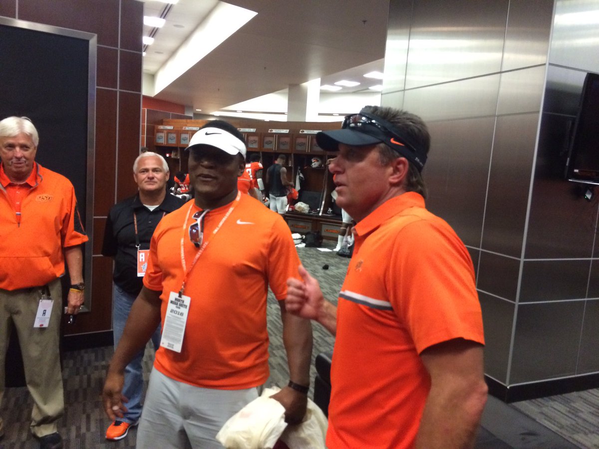 CowboyFB's tweet photo. A victorious coach and a proud dad after a game. #okstate #GoPokes @BarrySanders @CoachGundy https://t.co/KvRLiiTdtV