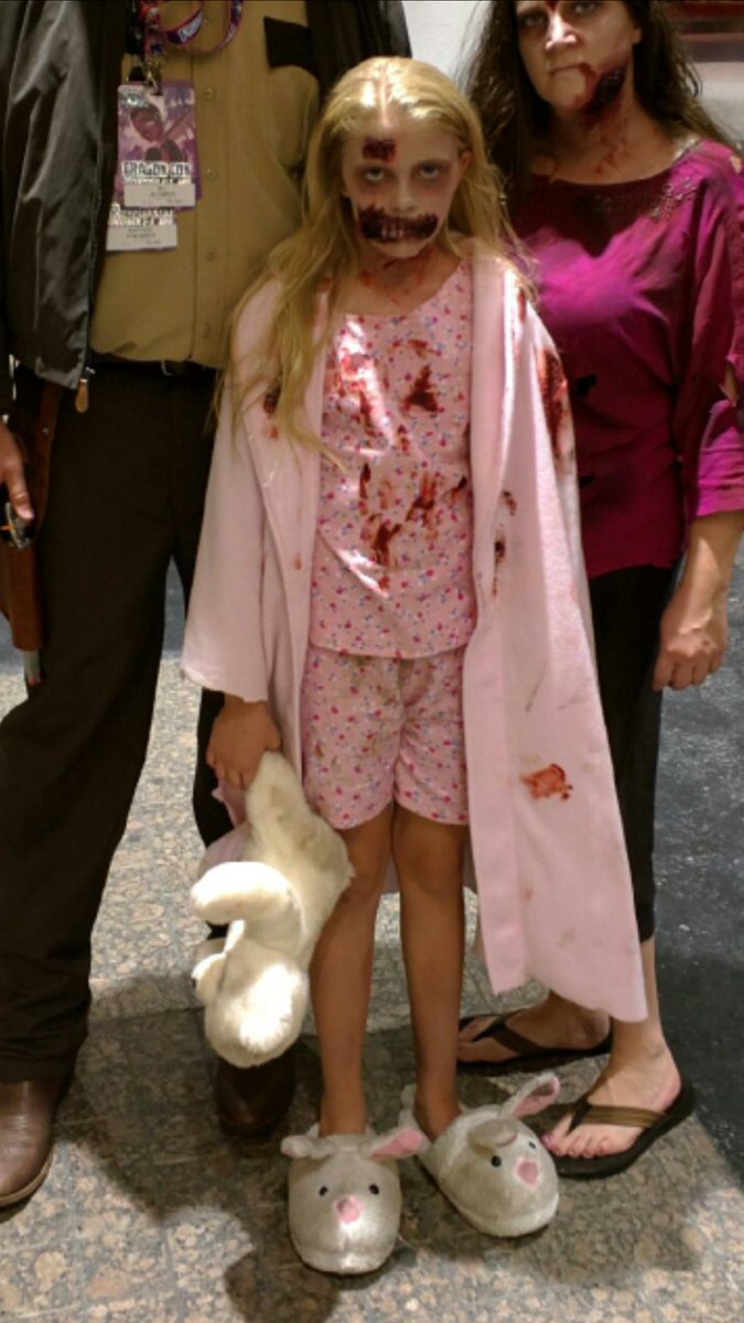 walking dead little girl picks up teddy bear
