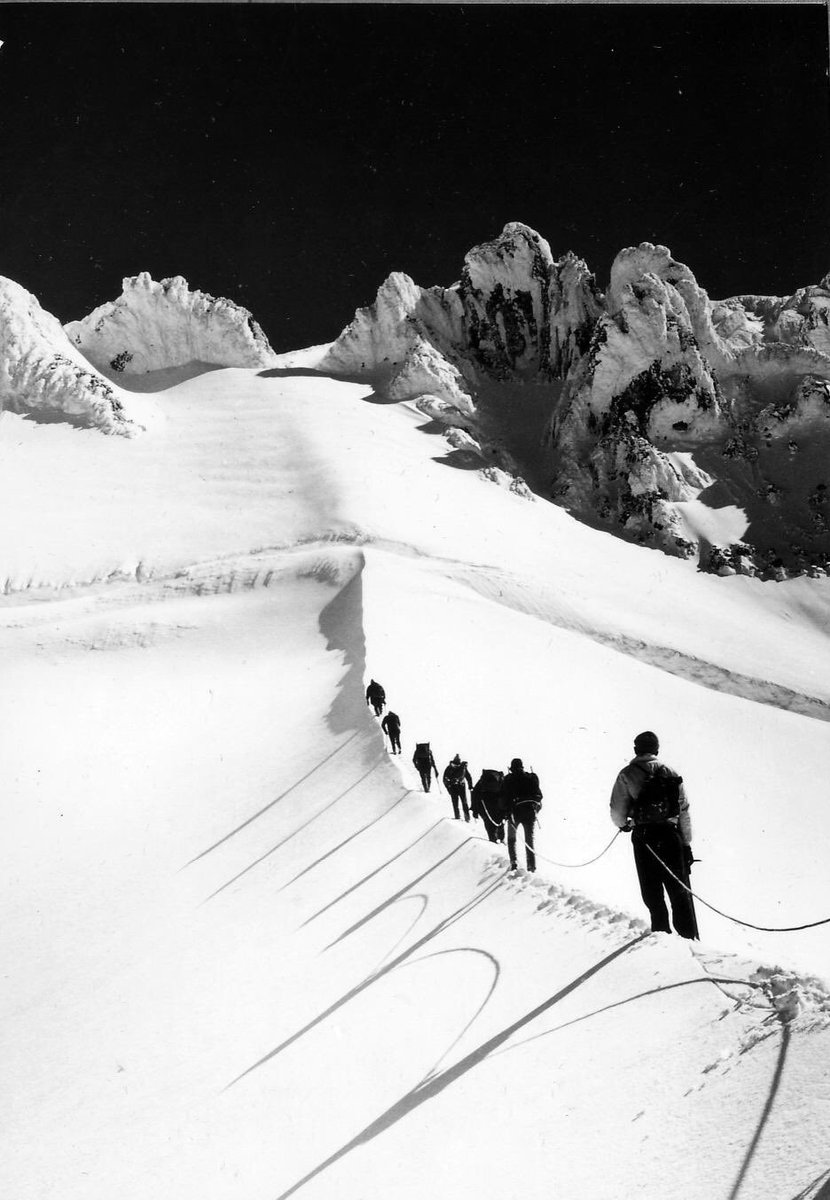 Mazamas climbing group along Hogsback, Mt. Hood in 1963. The jagged mountain terraces looming above them #Throwback