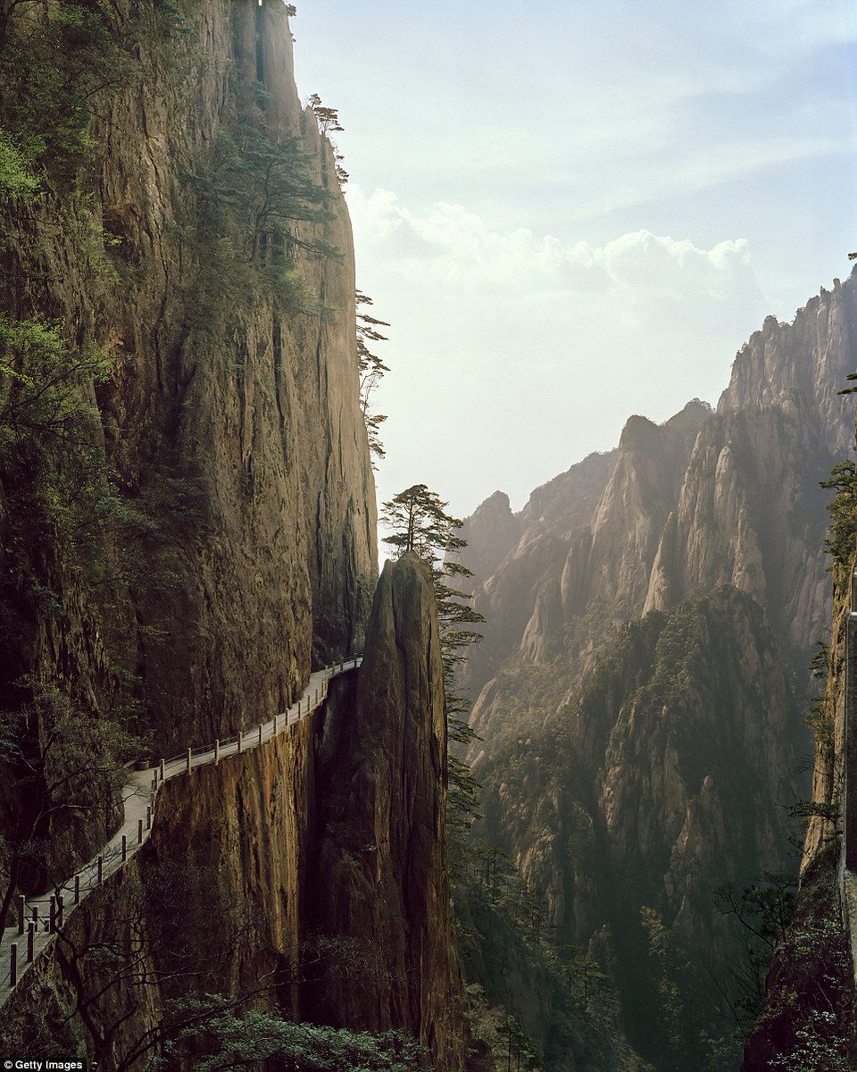 InPic: a wooden walkway winding along the cliffs of the Huangshan mountain in east China's Anhui province | People's Daily,China | Scoopnest
