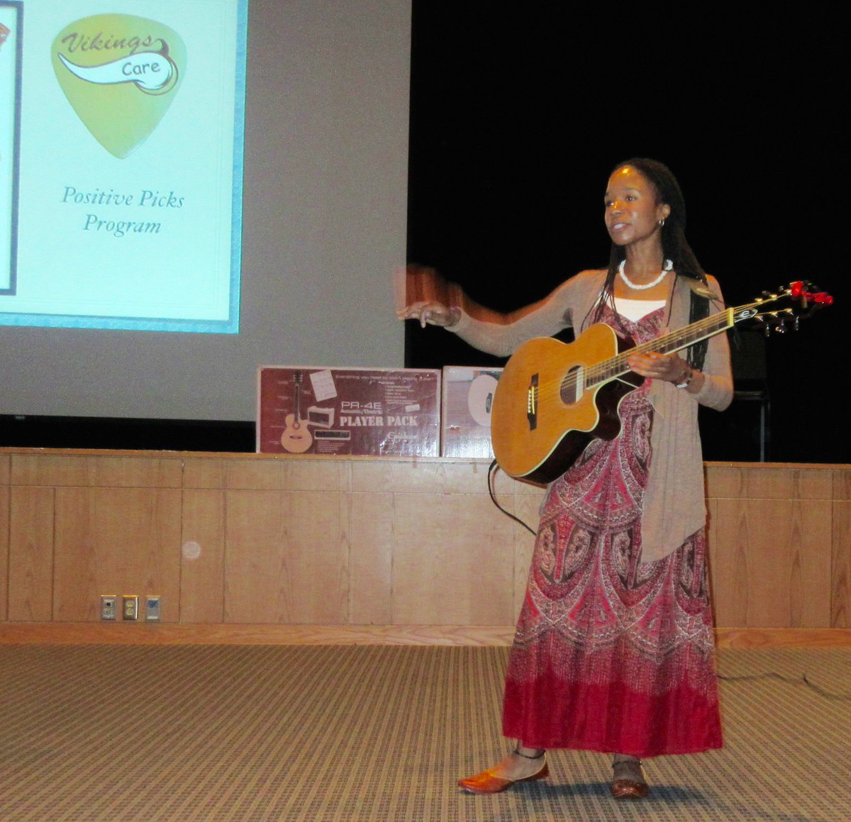 6th Grade Positive Picks: Ms. Seymour helps to demo the Positive Picks Guitar! Thanks to Sam Ash Music and our PTC!