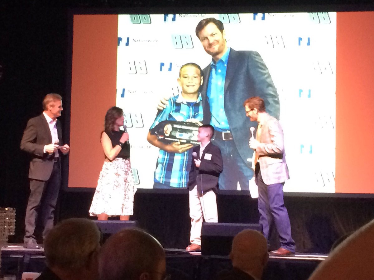 TeamHendrick's tweet photo. At tonight's Driven to Give event, @nationwidekids patient champion Dalton receives a replica #Batman88 helmet. 👍🏼 https://t.co/9tzHUtw2AJ