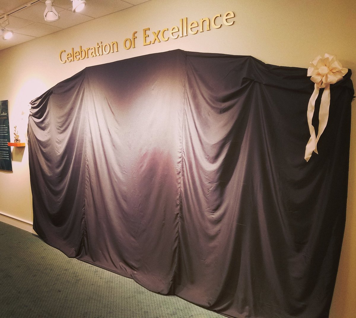 EnterpriseBank's tweet photo. #EBCOE16 awardees being celebrated w/dedication wall to remain on display at our HQ. We'll share reveal tomorrow! https://t.co/GPATgM6pbT