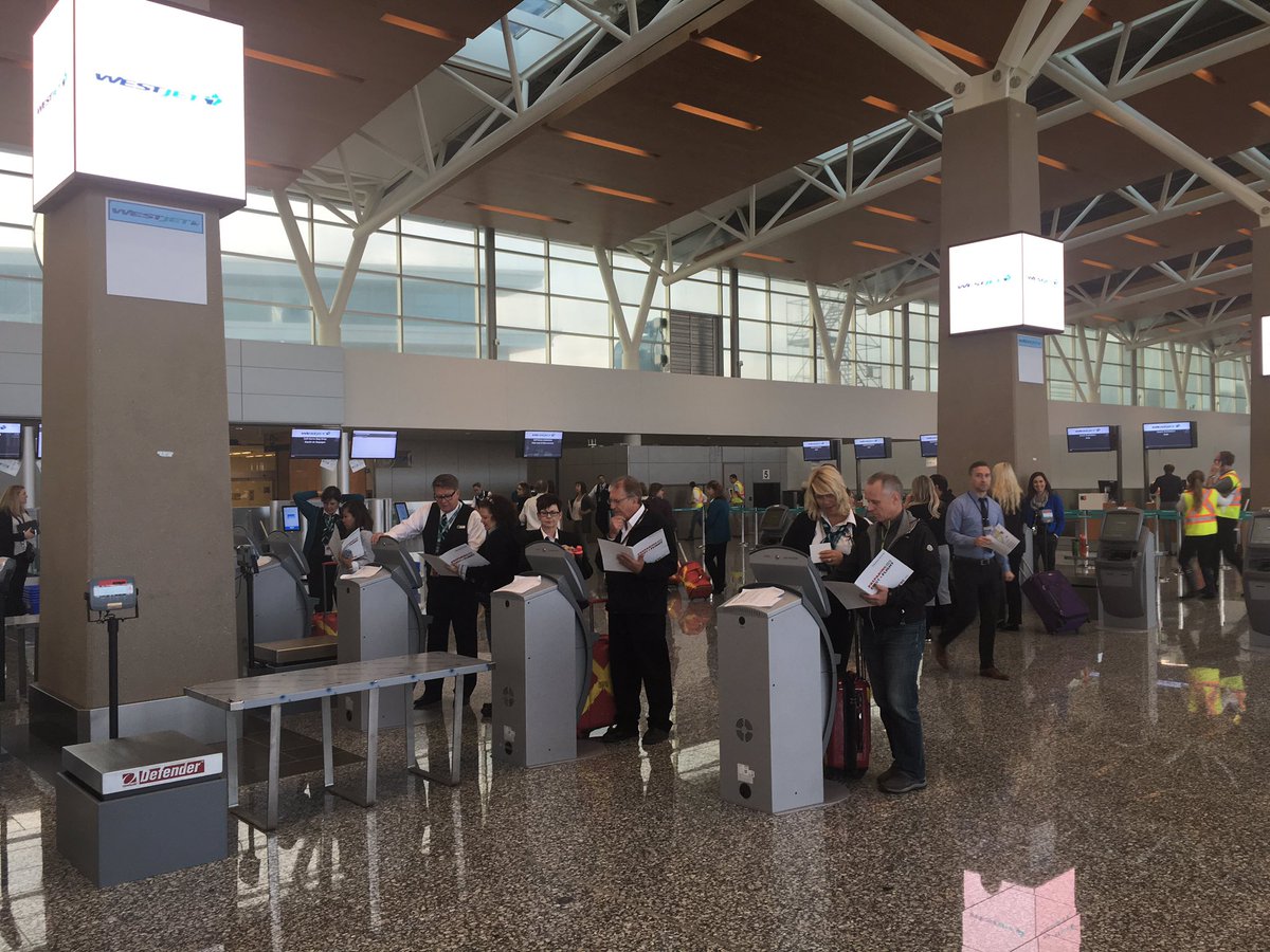 FlyYYC's tweet photo. Testing out the check-in process before their flight to Vegas #YYCexpansion https://t.co/o1kMSlM3yH