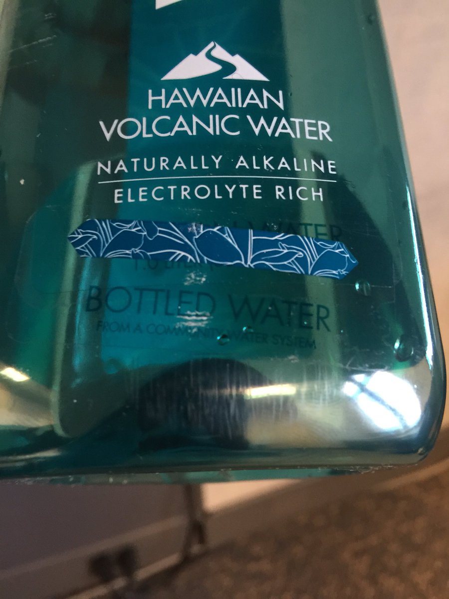 VCossette's tweet photo. @waiakea what's with my water? Sticker over the original label says bottled water from the community water system? https://t.co/EGJi3yIqL6