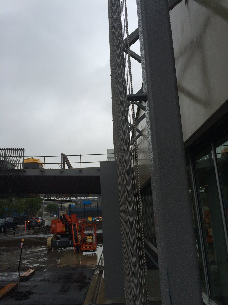 grantcramer's tweet photo. Rain in Melbourne? no stopping protgress #tensile #jakob #webnetmesh https://t.co/4VUhmpe7EM