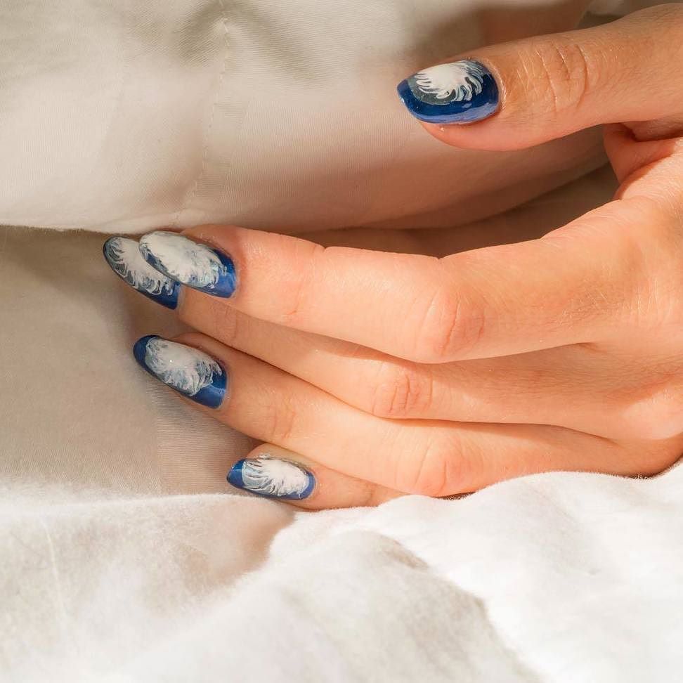 naildesignscom's tweet photo. This nail art from @bellacures is truly light as a feather. What do you think? #nailart #naildesign #feathernails https://t.co/RNQHsKkesh