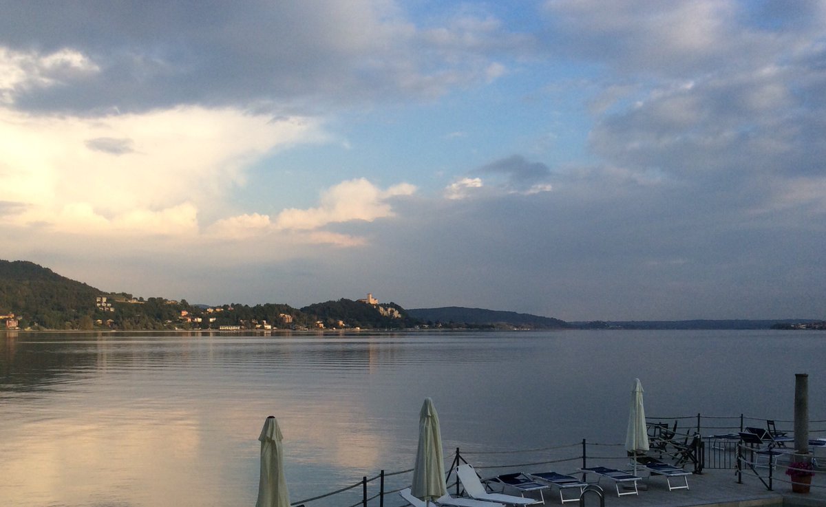 maggiore_sun's tweet photo. Evening comes to Angera with its mighty fortress visible from Meina and Arona. Ask us for more info #LakeMaggiore. https://t.co/dZf4HsRB0B