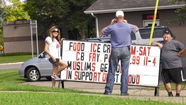 AlphaNews's tweet photo. A controversial sign brings protests AND increases business to a #MN restaurant. https://t.co/gySm4CgS8B #StCloudUNITED #StCloudTogether https://t.co/jl4DQYSMi2