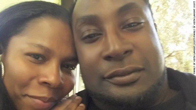 cnnbrk's tweet photo. Keith Lamont Scott death: Family wants to see shooting video; 9 civilians hurt and 44 arrested in Charlotte protests https://t.co/xGPMCieGlI https://t.co/A7Y8qTykAJ