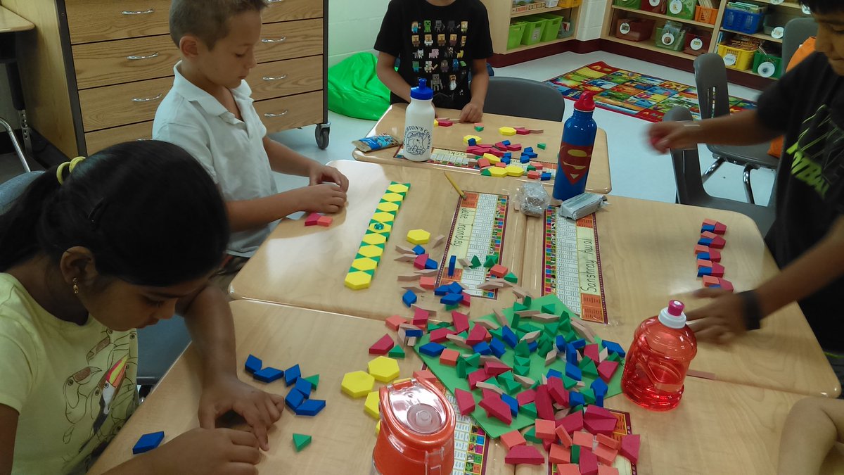 2ND graders exploring pattern blocks to create repeating and growing patterns.  #MTES1yr   <a href="/MadisonsTrust16/">Madison's Trust E.S.</a>