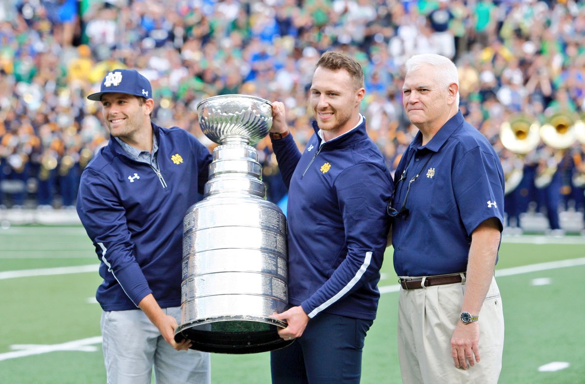 NDHockey's tweet photo. Ian Cole, Bryan Rust &amp; a proud @NDCoachJackson accompanied the Stanley Cup into Notre Dame stadium this afternoon! https://t.co/MZ2dQGjrjC