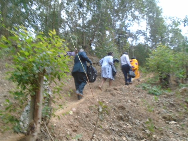ASSHU2020's tweet photo. The Chairperson Leading the team to the top facing Lake Bunyonyi https://t.co/YU90OvhHW3