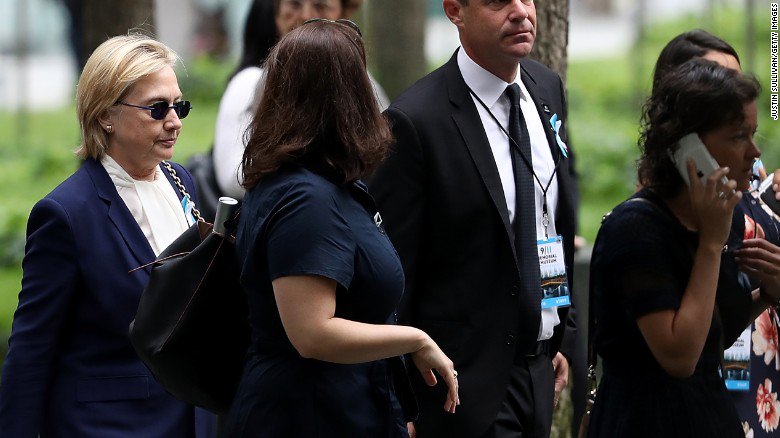 CNNPolitics's tweet photo. Hillary Clinton leaves a 9/11 ceremony after feeling overheated, her campaign says https://t.co/DB0F6haLpe https://t.co/IZQwqfuMNP