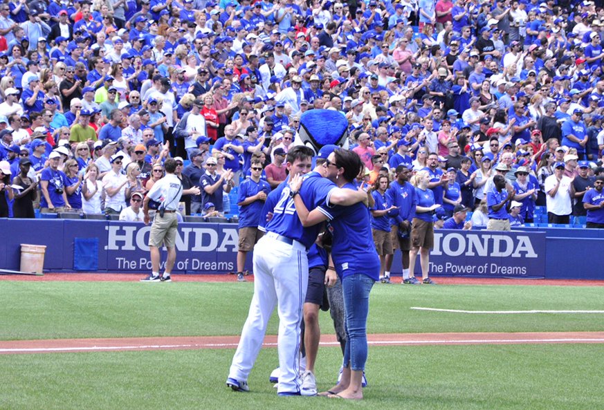BlueJays's tweet photo. Family of fallen firefighter, corrections officer and CAF veteran, Patrick Pidgeon, threw out today’s first pitch. https://t.co/27Xdx5nGIV