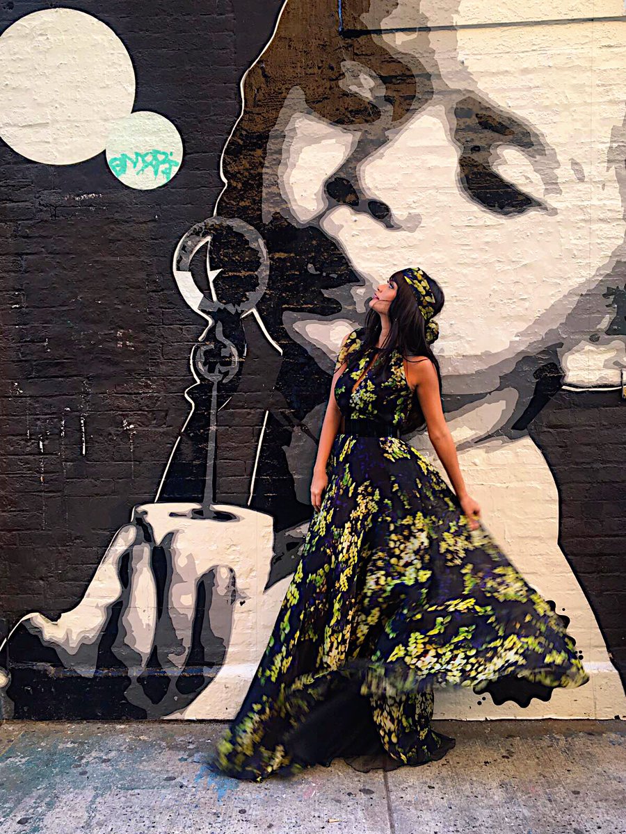 MissUniverse's tweet photo. Taking a moment during this whirlwind week. Loving this @CarmenMarcValvo look for today's @nyfw show. #NYFW https://t.co/EHhhF1etMp