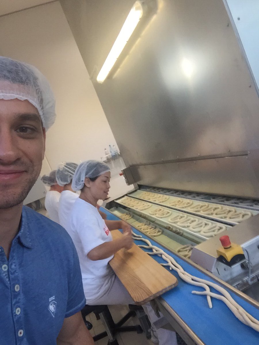 thesizzle22's tweet photo. Fun time at #backhaushackner factory. These women hand twist 50,000 pretzels a day! @ERCIngolstadt https://t.co/UrXYxiandj
