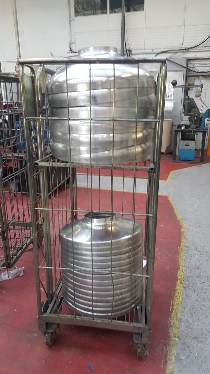 Stainless steel dished ends for a cryogenic vessel, ready to be packed up and sent for delivery