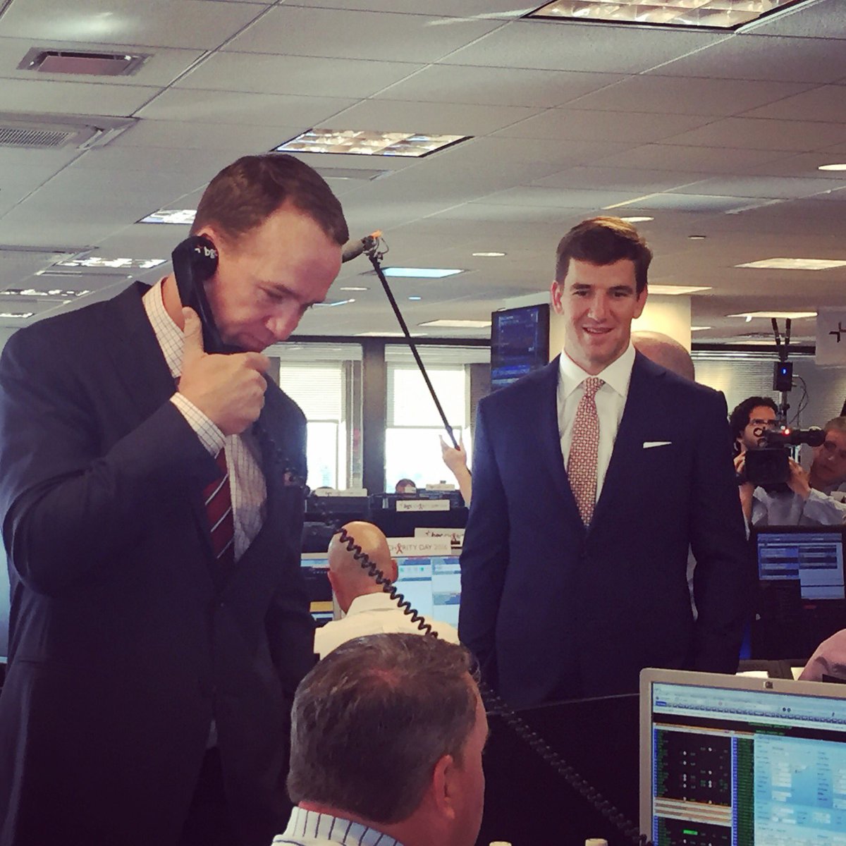 BGCCharityDay's tweet photo. The QBs of #BGCCharityDay! 🏈 #PeytonManning and #EliManning raising funds for #PeybackFoundation &amp; @UMMCnews! #NYC https://t.co/USJRCiJHFl