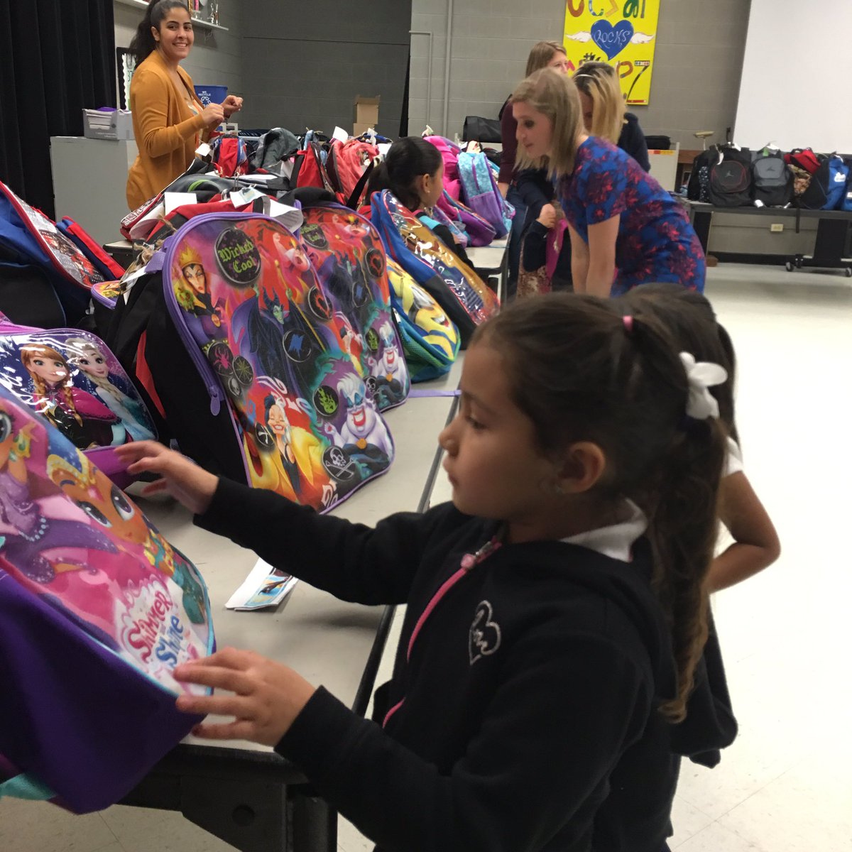 Hyatt's tweet photo. Today colleagues are handing out backpacks at #ChavezElementary, wishing the students a happy & successful year! https://t.co/SH2Hkv3IEI