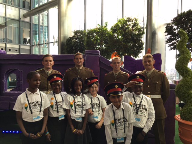 CardwellSE18's tweet photo. Pupils with Levi Roots, Sadiq Khan and the Grenadier Guards at Canary Wharf. https://t.co/YpmO9uF2UK