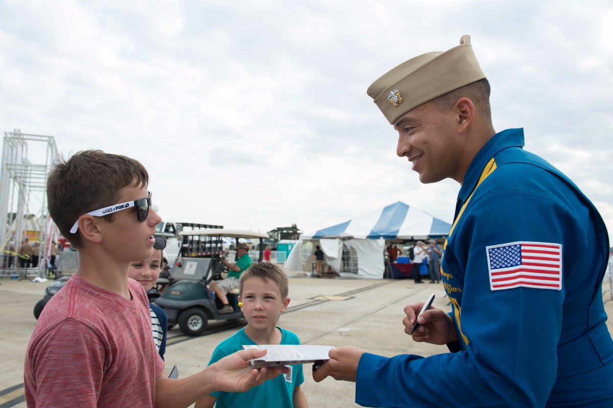 OceanaAirShow's tweet photo. The @BlueAngels greeting #OceanaAirShow patrons and signing their booklets. #NASOceana #USNavy #BlueAngelsFly https://t.co/9JEfGZHJq5