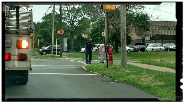 syracusedotcom's tweet photo. Caught doing good: Syracuse firefighter helps elderly woman cross the street (Your letters) https://t.co/VDHAB3Nheu https://t.co/LkXohvigSX