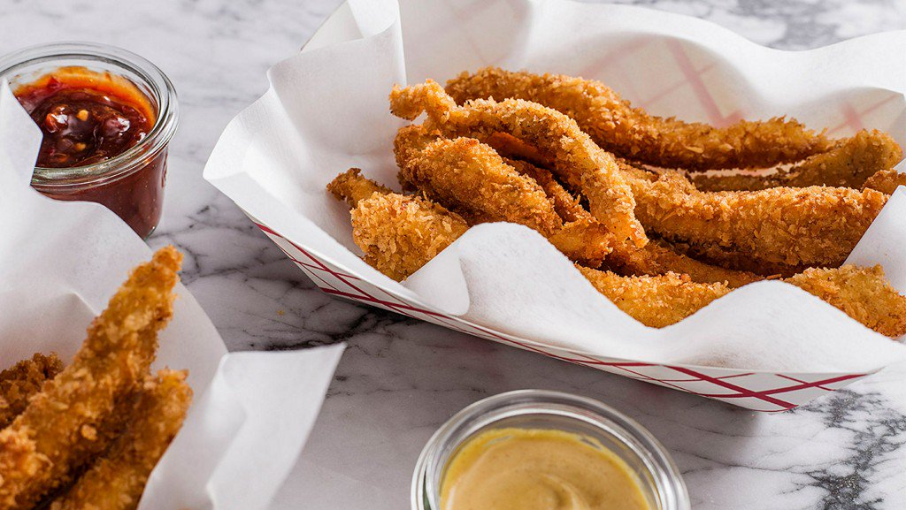 TastingTable's tweet image. Forget fast food and make crispy chicken fries and dipping sauces at home: bit.ly/2c5YIgO