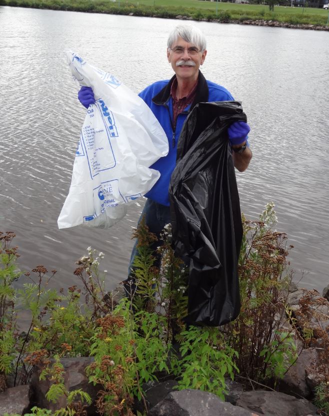 UWiscSeaGrant's tweet photo. Why is Gene Clark smiling? Because he and @LSNERR staff spent the afternoon cleaning up trash on Barker's Island. https://t.co/nS0gJL0u6D